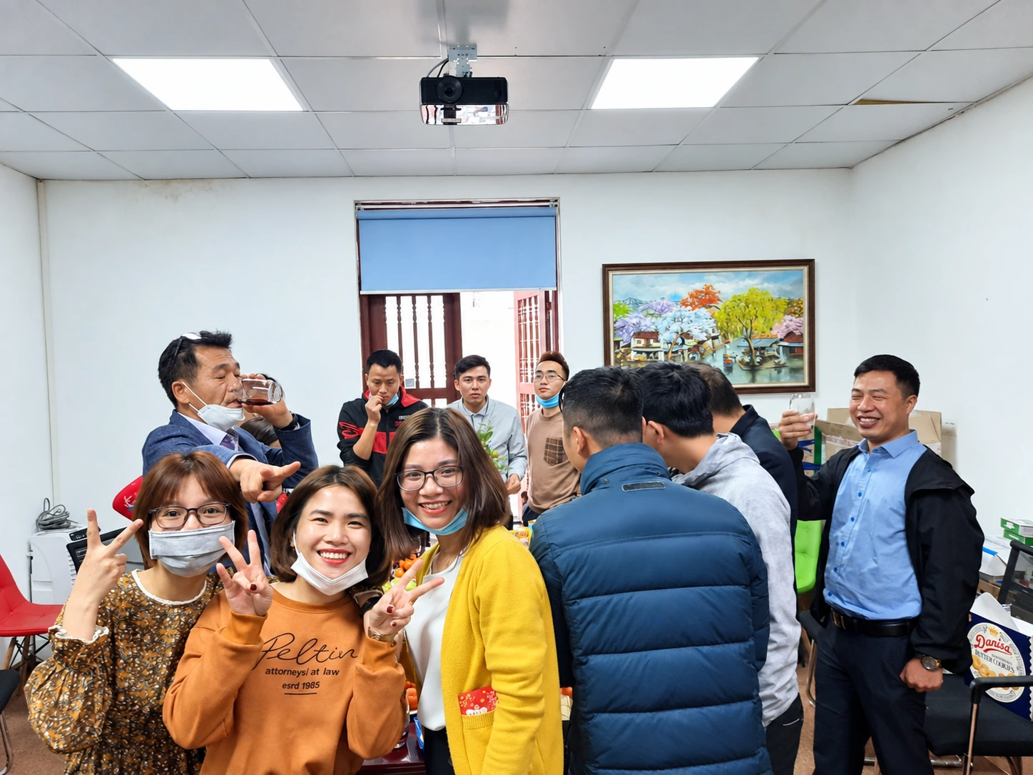 Colleagues chatting and taking photos at a team gathering
